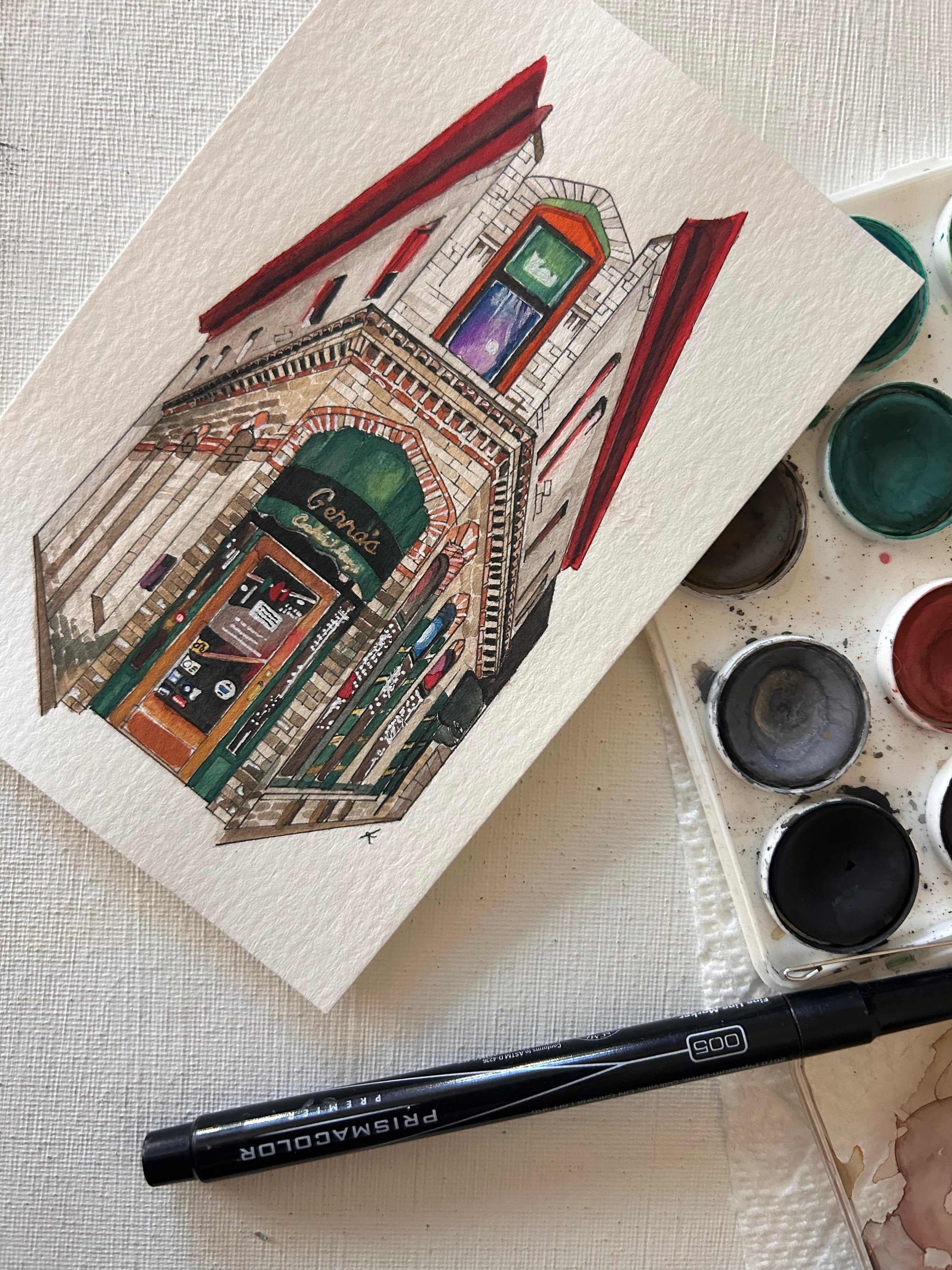 Artistic depiction of a building with watercolor paints and a pen on a textured surface